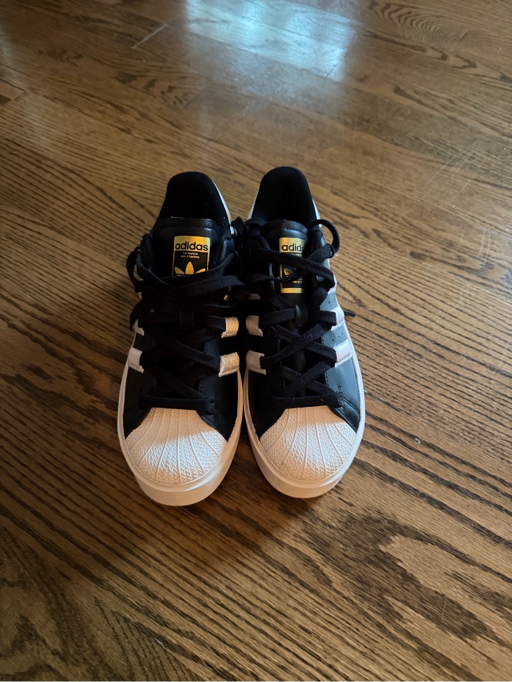 adidas  Black and White Shell Toe Sneakers with Gold Logo